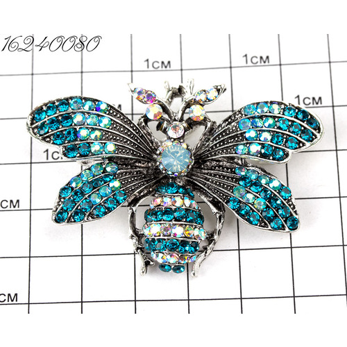 Броши жук